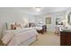 Bright bedroom with two beds, neutral carpeting, and natural light from the windows at 2000 Old Dominion Rd, Atlanta, GA 30350