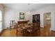 Formal dining room featuring hardwood floors, elegant wainscoting, and a crystal chandelier at 2000 Old Dominion Rd, Atlanta, GA 30350