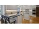 Bright kitchen boasting white cabinets, island seating, and stainless steel appliances at 2000 Old Dominion Rd, Atlanta, GA 30350
