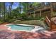 Inviting backyard pool surrounded by wooden deck and professional landscaping at 2000 Old Dominion Rd, Atlanta, GA 30350