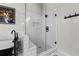 Modern shower with glass door, white subway tile, and black fixtures at 2518 Oakwood Se Way, Smyrna, GA 30080