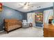 Bedroom offers a wooden crib, comfortable recliner, and celestial-themed decor at 2518 Oakwood Se Way, Smyrna, GA 30080