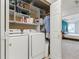Walk-in closet featuring wire shelving and laundry area at 2518 Oakwood Se Way, Smyrna, GA 30080