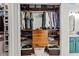 Walk-in closet featuring custom wood shelving, drawers, and ample storage space at 2518 Oakwood Se Way, Smyrna, GA 30080