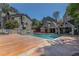 Community pool with lounge chairs and a fenced perimeter offers a recreational amenity at 2518 Oakwood Se Way, Smyrna, GA 30080