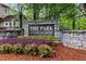 Community sign in a landscaped area provides an attractive entrance to the neighborhood at 2518 Oakwood Se Way, Smyrna, GA 30080
