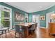 Elegant dining room showcasing hardwood floors, tasteful decor, and ample natural light from large windows at 2518 Oakwood Se Way, Smyrna, GA 30080