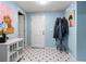 Entryway with tile flooring, white storage cabinet, and artwork provides a welcoming space at 2518 Oakwood Se Way, Smyrna, GA 30080