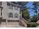 Stylish two-story townhouse featuring a two-car garage and a charming entrance with steps at 2518 Oakwood Se Way, Smyrna, GA 30080