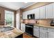 Kitchen features modern appliances, granite counters and tile backsplash at 2518 Oakwood Se Way, Smyrna, GA 30080