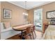 Cozy breakfast nook with custom bench seating, wood floors and modern pendant lighting at 2518 Oakwood Se Way, Smyrna, GA 30080