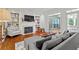 Cozy living room featuring a fireplace, built-in bookshelves, and comfortable seating arrangement at 2518 Oakwood Se Way, Smyrna, GA 30080