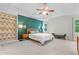 Spacious main bedroom features a tray ceiling, accent wall, and ample natural light at 2518 Oakwood Se Way, Smyrna, GA 30080