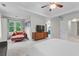Main bedroom featuring tray ceiling, sitting area, and neutral color palette at 2518 Oakwood Se Way, Smyrna, GA 30080