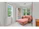 Cozy sitting area with bookshelves, plush seating, and large windows at 2518 Oakwood Se Way, Smyrna, GA 30080