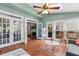 Bright sunroom featuring French doors, hardwood floors, and a vaulted ceiling with a skylight at 2518 Oakwood Se Way, Smyrna, GA 30080