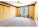 Bedroom featuring a ceiling fan, natural light, carpet flooring, and wallpaper border at 3670 Whirlaway Dr, Decatur, GA 30034
