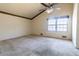 Bedroom featuring a vaulted ceiling, large window, and carpet flooring at 3670 Whirlaway Dr, Decatur, GA 30034