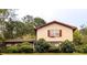 Two-story home with manicured lawn and garden at 3670 Whirlaway Dr, Decatur, GA 30034