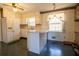 Bright kitchen featuring a center island and ample cabinet space at 3670 Whirlaway Dr, Decatur, GA 30034