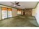 Open living room featuring brick fireplace, shelving, and french doors at 3670 Whirlaway Dr, Decatur, GA 30034