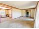 Open-concept living room featuring chandelier and adjacent dining area at 3670 Whirlaway Dr, Decatur, GA 30034