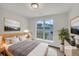 Bright bedroom with a large window and neutral decor at 7240 Raintree Loop, Jonesboro, GA 30236