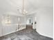 Open-concept dining area with view of staircase, entry hall, and living area at 7240 Raintree Loop, Jonesboro, GA 30236