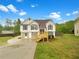 Charming two-story home with landscaped yard and inviting front porch at 7240 Raintree Loop, Jonesboro, GA 30236