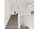 Inviting foyer with carpeted staircase and lots of light at 7240 Raintree Loop, Jonesboro, GA 30236