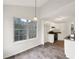 Bright kitchen features white cabinets, stainless steel appliances, and a large window at 7240 Raintree Loop, Jonesboro, GA 30236