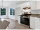 Spacious kitchen with stainless appliances, granite countertops, and bright eat-in area at 7240 Raintree Loop, Jonesboro, GA 30236