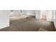 Large living room with neutral carpet and lots of light at 7240 Raintree Loop, Jonesboro, GA 30236