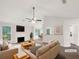 Bright living room with a fireplace, neutral decor, and large windows at 7240 Raintree Loop, Jonesboro, GA 30236