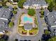 Bird's eye view of a community pool, clubhouse, and well-maintained condo buildings at 108 Vinings Forest Se Cir, Smyrna, GA 30080