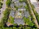 Wide aerial perspective of a condo community with a pool, surrounded by trees at 108 Vinings Forest Se Cir, Smyrna, GA 30080