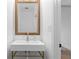 Contemporary bathroom with a floating sink, golden fixtures, and a decorative mirror at 108 Vinings Forest Se Cir, Smyrna, GA 30080