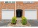 Charming brick building facade with convenient garage access, enhancing curb appeal at 108 Vinings Forest Se Cir, Smyrna, GA 30080