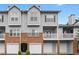 Attractive townhouse complex with brick accents, balconies, and convenient garage parking at 108 Vinings Forest Se Cir, Smyrna, GA 30080