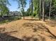 A fenced dog park with trees providing shade, offering space for pets to play at 108 Vinings Forest Se Cir, Smyrna, GA 30080