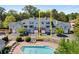 Inviting townhome community with a sparkling pool, and ample parking at 108 Vinings Forest Se Cir, Smyrna, GA 30080