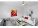 Stylish living room features a grey sofa, bright couches, and modern art for a vibrant and inviting space at 108 Vinings Forest Se Cir, Smyrna, GA 30080