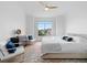 Spacious main bedroom with a large window, hardwood floors, and modern decor at 108 Vinings Forest Se Cir, Smyrna, GA 30080