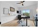 Inviting home office with a large window, streamlined desk, and light wood flooring at 108 Vinings Forest Se Cir, Smyrna, GA 30080