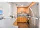 Open kitchen with stainless steel appliances, bar seating, and modern cabinetry at 215 Piedmont Ne Ave # 1110, Atlanta, GA 30308