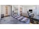 Bedroom with a bed, desk, hardwood flooring, and view to the living room at 215 Piedmont Ne Ave # 1110, Atlanta, GA 30308