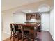 Basement bar area featuring wood floors, a sink, cabinets and seating for three at 4310 Wellbrook Ct, Douglasville, GA 30135