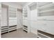Walk-in closet with custom shelving and ample storage space for organized wardrobe management at 4310 Wellbrook Ct, Douglasville, GA 30135