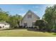 Spacious lawn surrounds this charming home with manicured shrubbery and inviting curb appeal at 4310 Wellbrook Ct, Douglasville, GA 30135