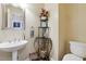 Half bathroom featuring pedestal sink and decorative shelf at 4310 Wellbrook Ct, Douglasville, GA 30135